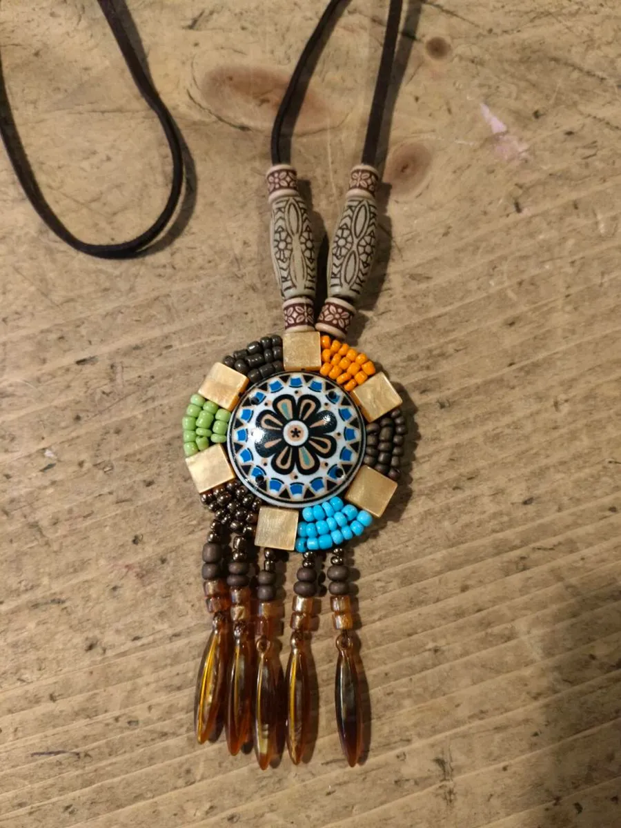 This is a bohemian-style long necklace featuring a - Image 2