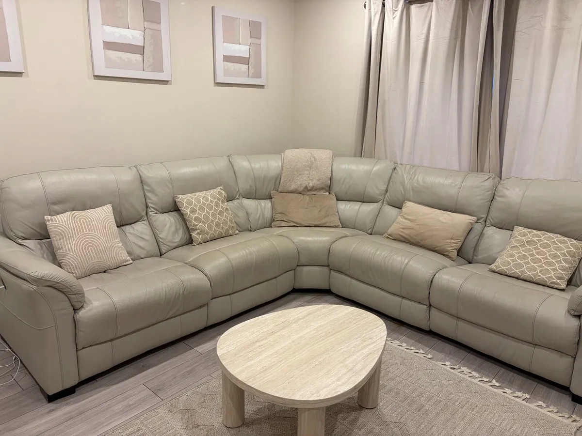 Cream leather reclining sofa with charging ports - Image 1