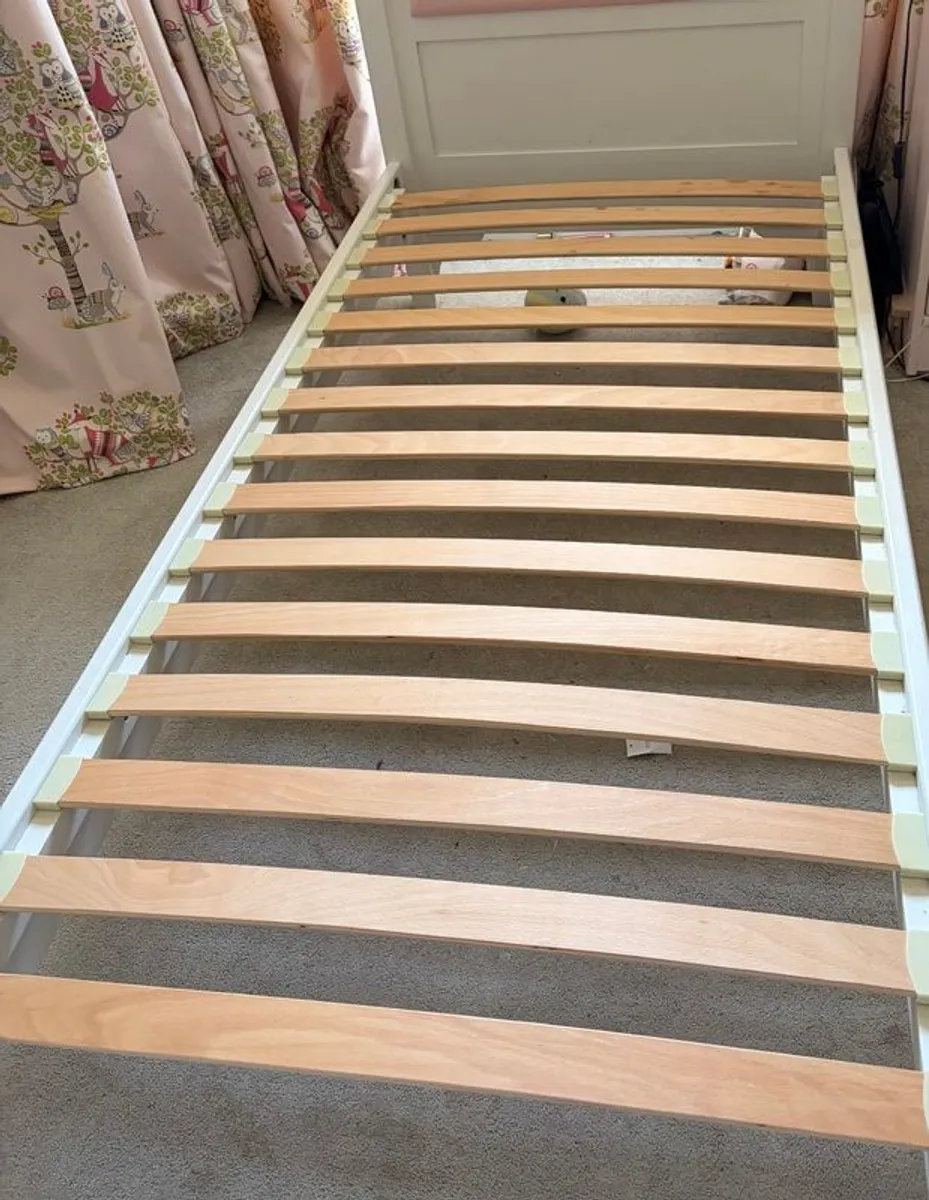 Wooden Single bed with Pink Headboard