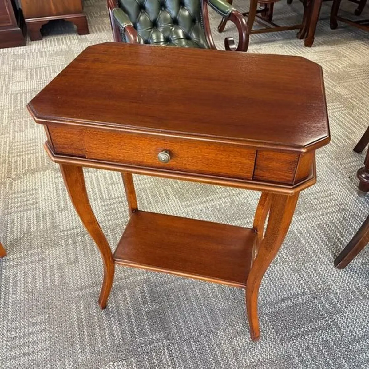 Charming mahogany two-tier side table featuring a
