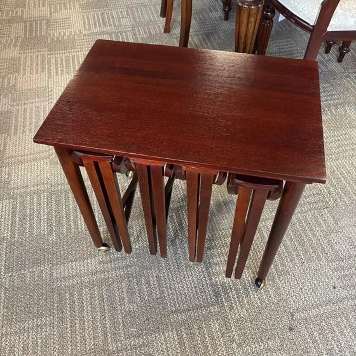 A quality Edwardian-style mahogany nest of four oc