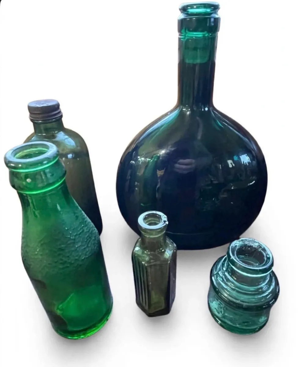 Collection of vintage green bottles