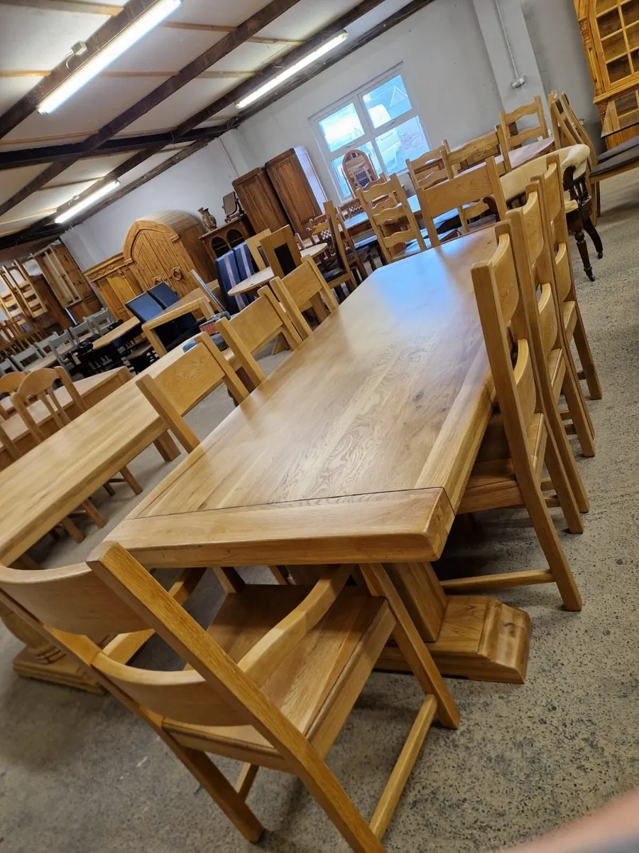 7ft, 8 inches oak trestle table, 8 oak chairs - Image 1