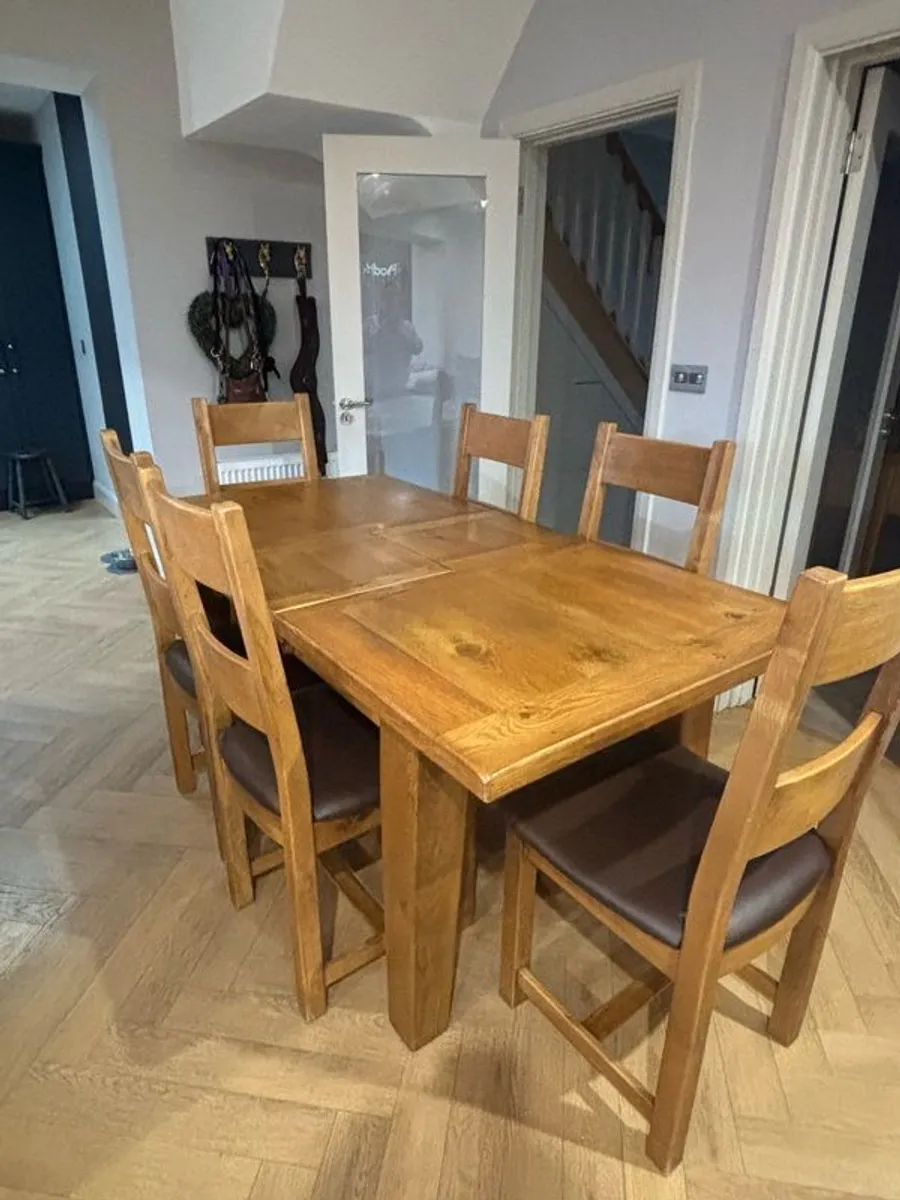 Extendable Solid Oak Dining Table & 6 leather dining chairs - Image 1
