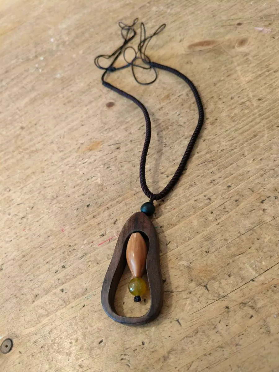 wooden pendant necklace featuring a dark brown woo - Image 2