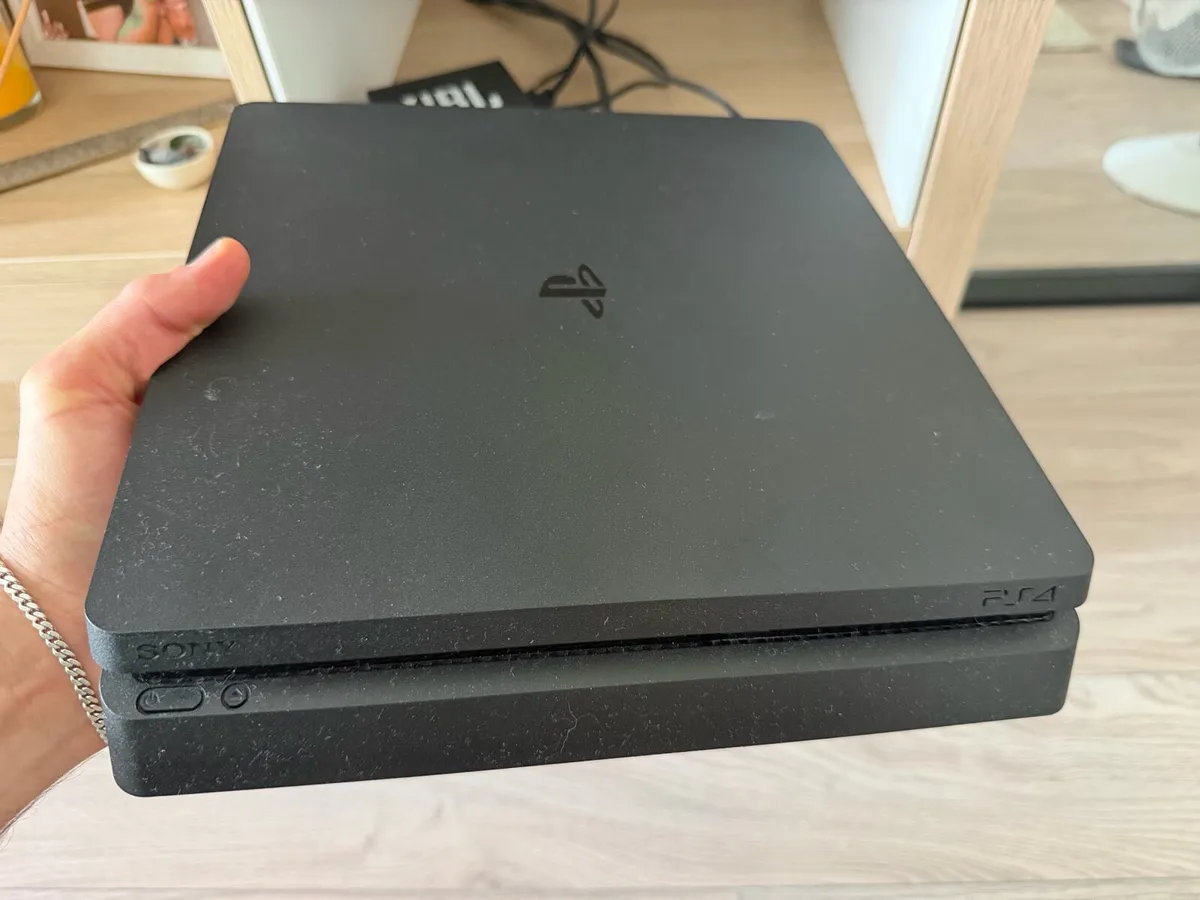 PS4 Slim 1TB + Controllers + 5 Games - Image 1