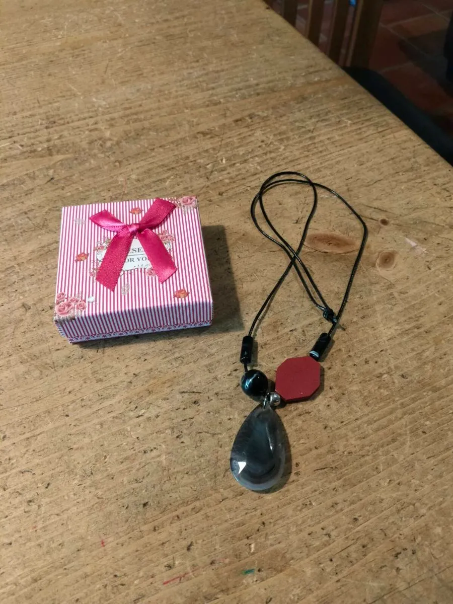 necklace featuring a striped black agate gemstone - Image 1