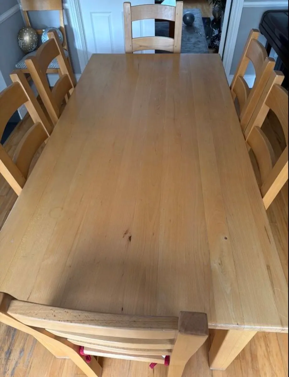 Solid wooden dining table and chairs - Image 1