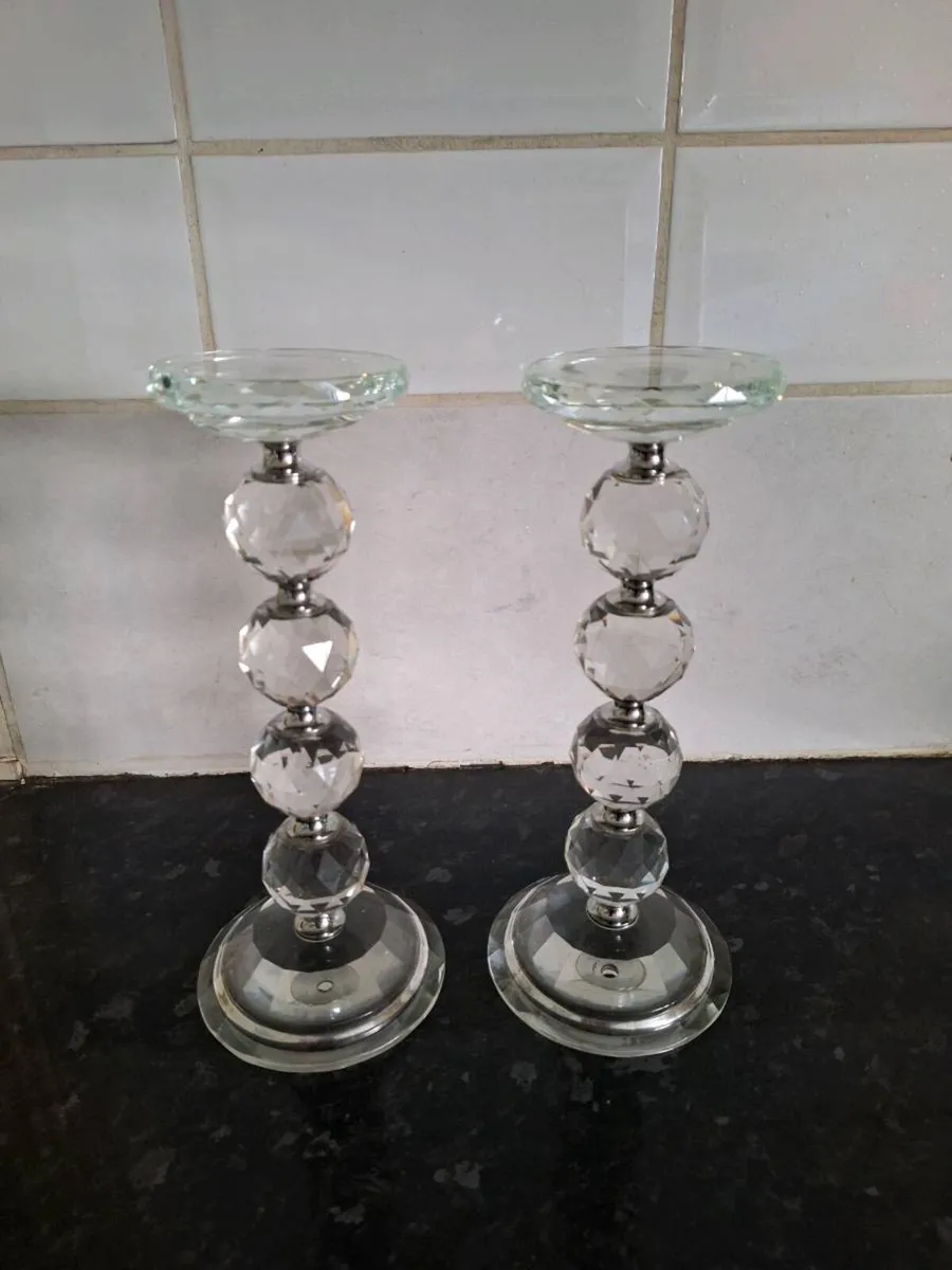 A pair of crystal glass pillar candleholders