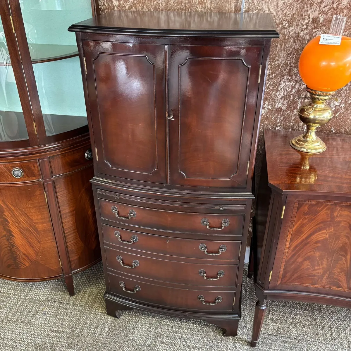 Handsome mahogany drinks cabinet featuring two cup - Image 1