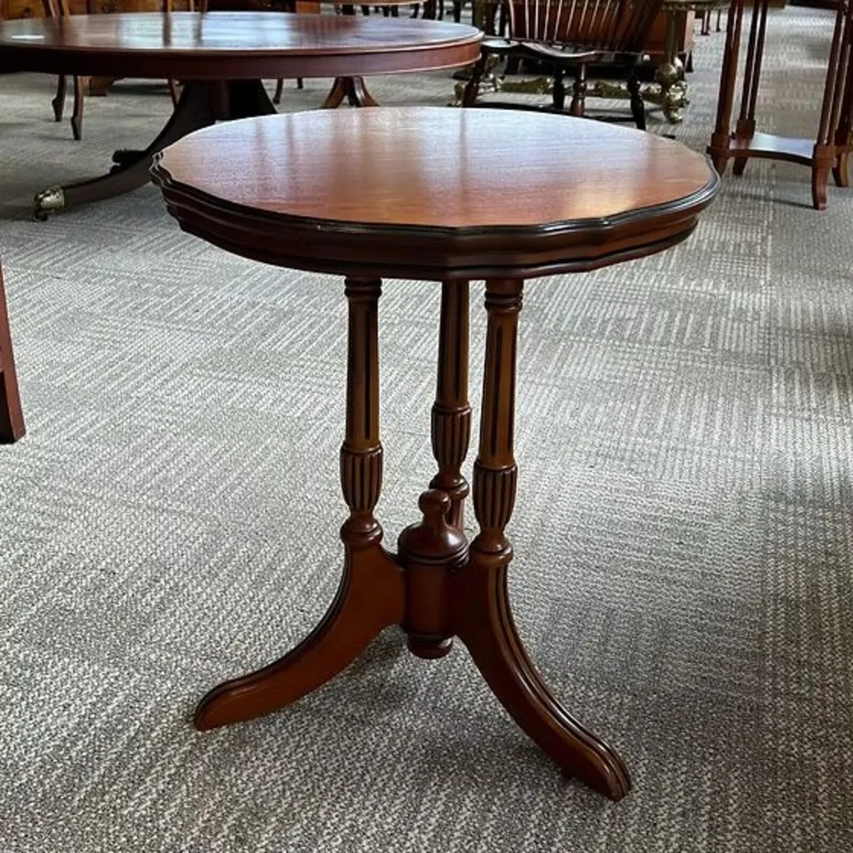 Shaped top yew wooden tripod occasional side table