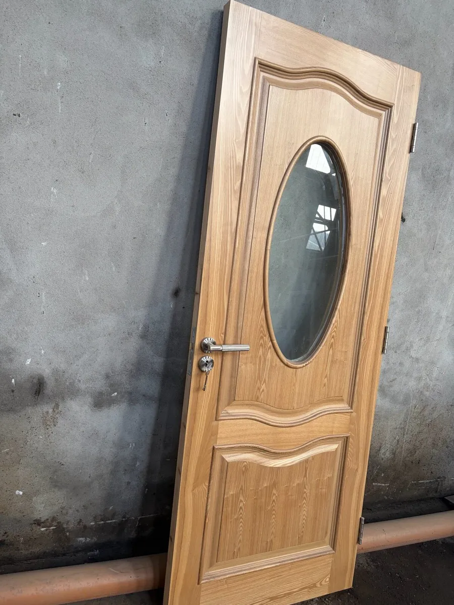 Veneer Oak Interior Doors with oval glass panel - Image 1