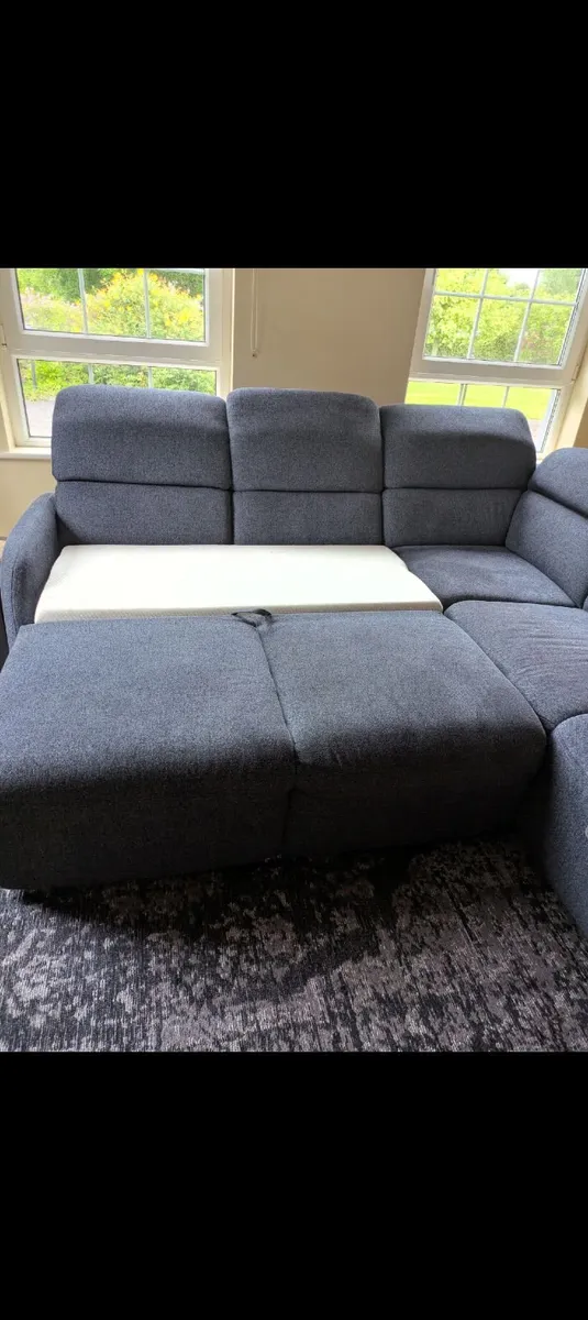 Corner couch with pull out bed and storage - Image 4