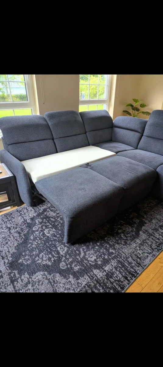Corner couch with pull out bed and storage - Image 2