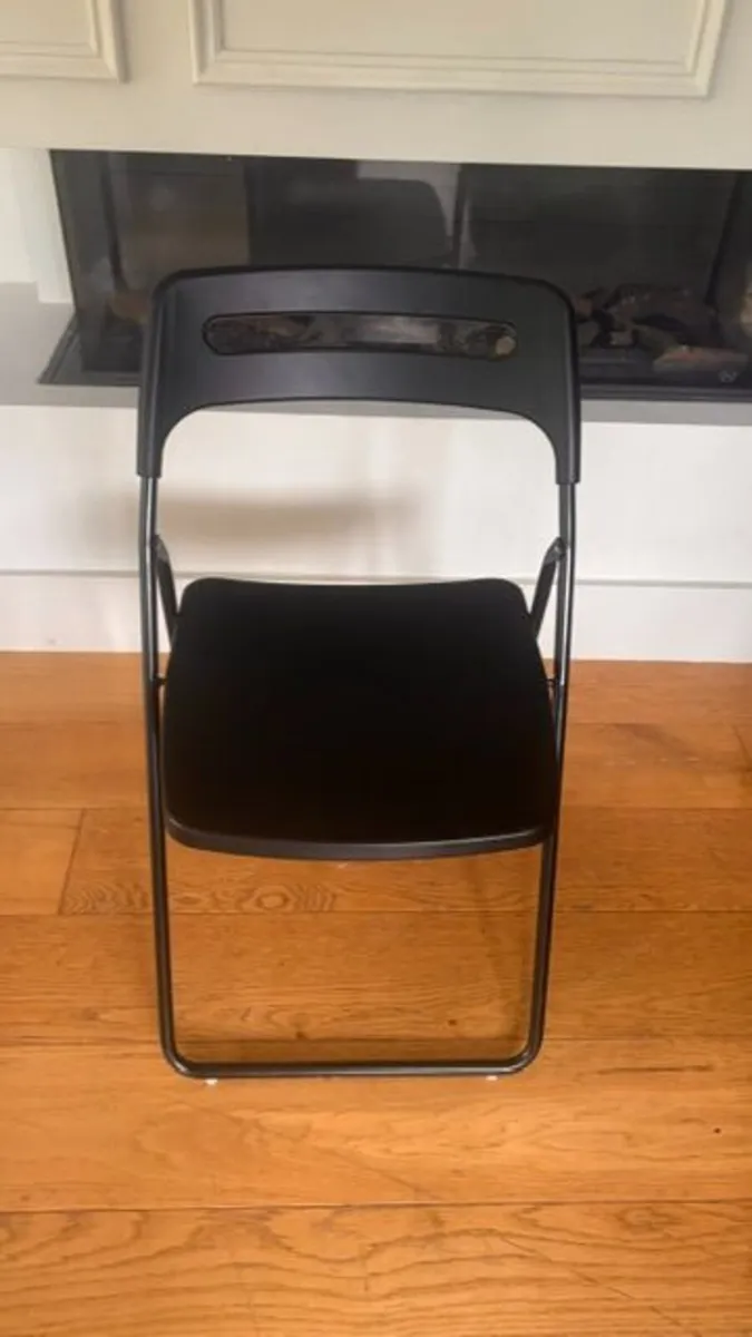 black folding chair - Image 1