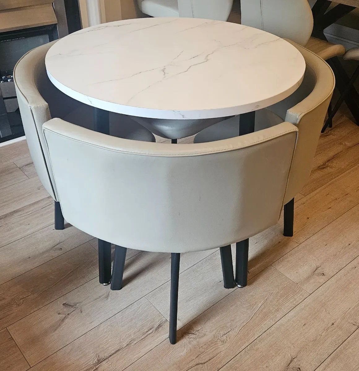 Round Table with Metal Legs and Leather Chairs - Image 1