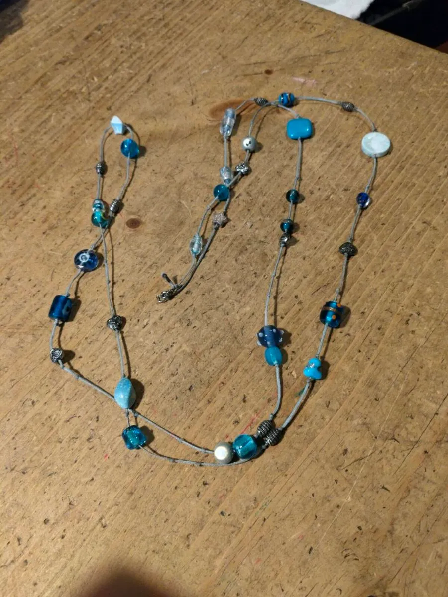long necklace featuring a mix of blue-toned glass - Image 2