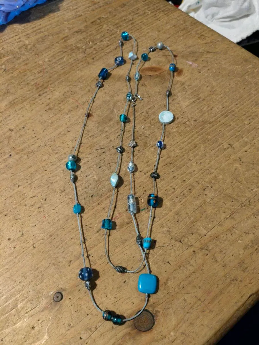 long necklace featuring a mix of blue-toned glass - Image 3