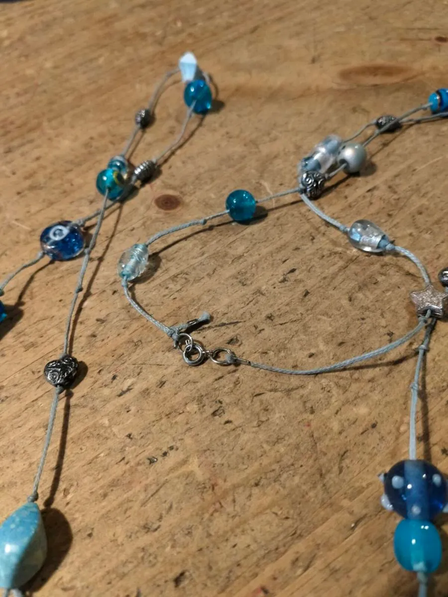 long necklace featuring a mix of blue-toned glass - Image 4