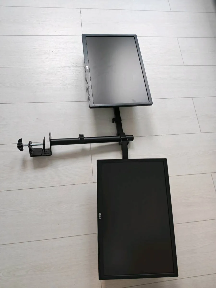 2 x LG 22 inch monitors with arms mount to the des - Image 1