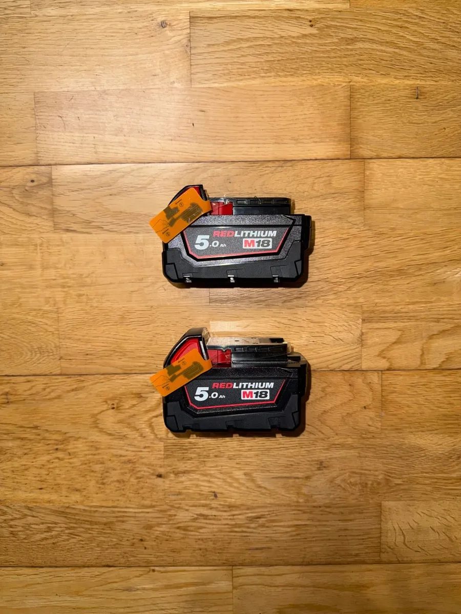 Milwaukee M18 18V 5.0Ah Red Lithium Batteries x2 - Image 1