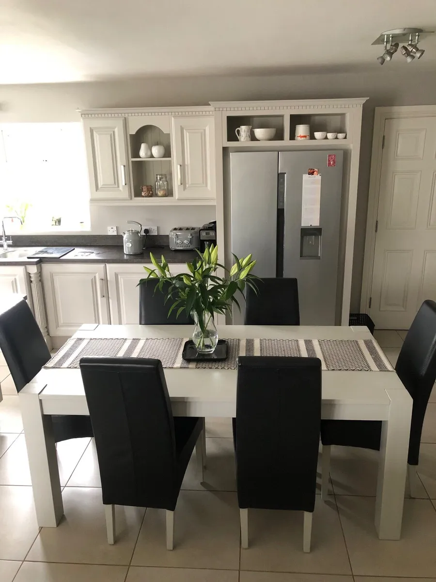 Oak Dining room table and leather chairs