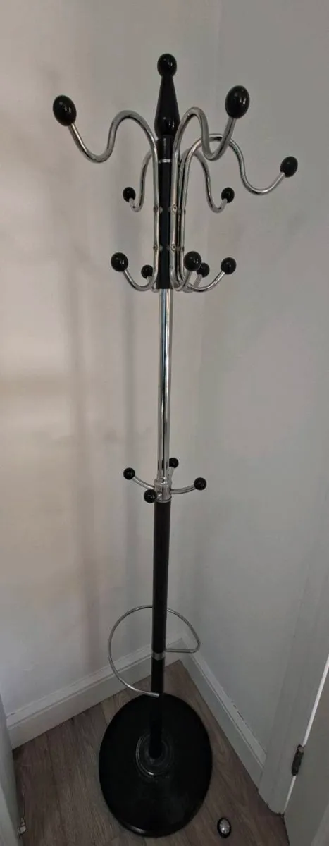 Coat hanger stand/rack with sturdy stone base.