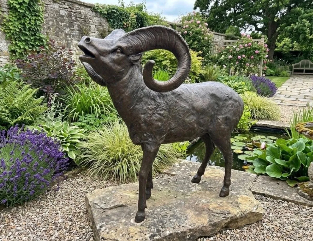 Bronze puck goat sculpture
