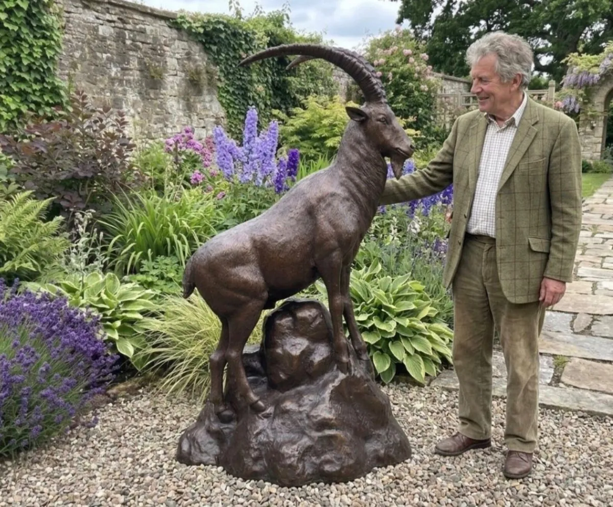 Bronze ibex on rock sculpture