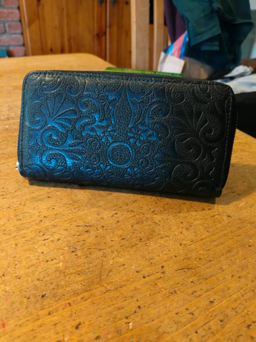 black Dewest zipper wallet featuring an embossed f - Image 1