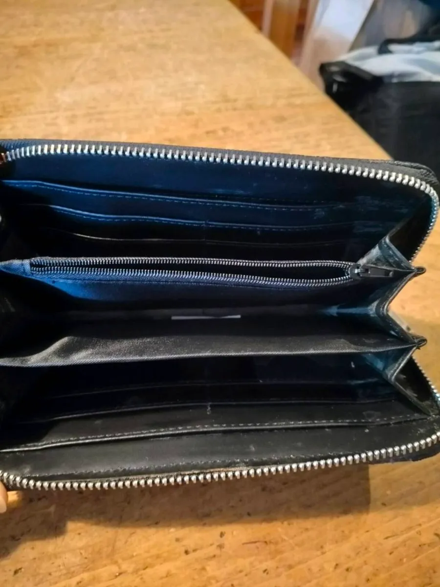 black Dewest zipper wallet featuring an embossed f - Image 3