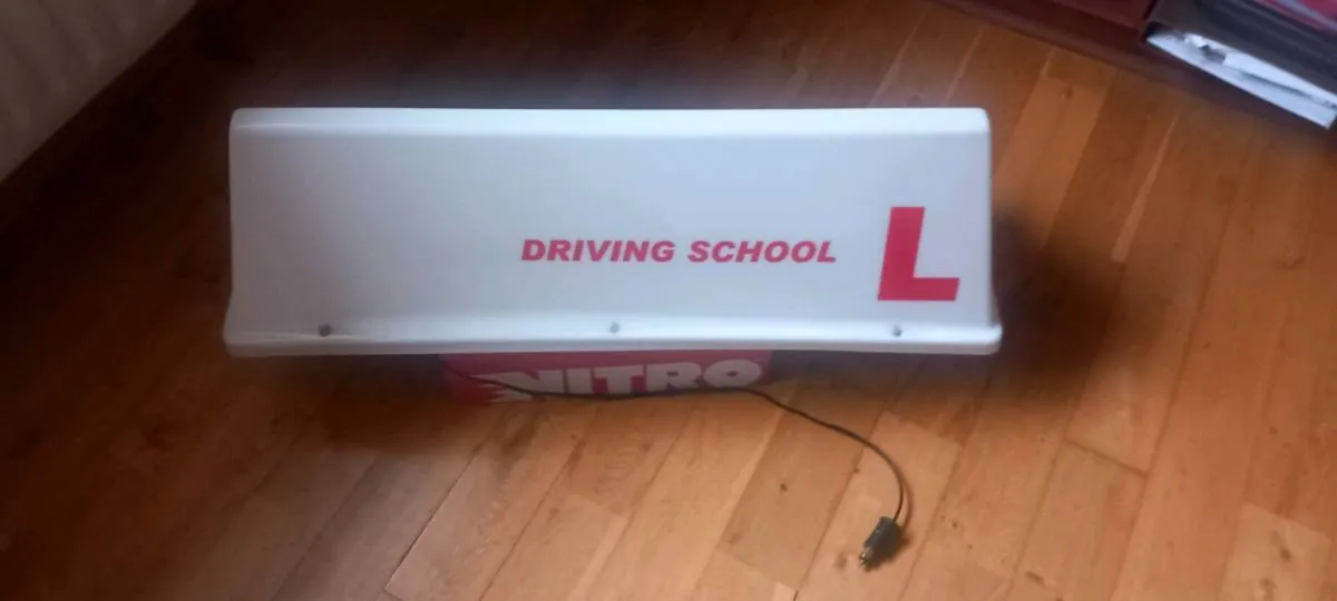 Illuminated driving school roof sign