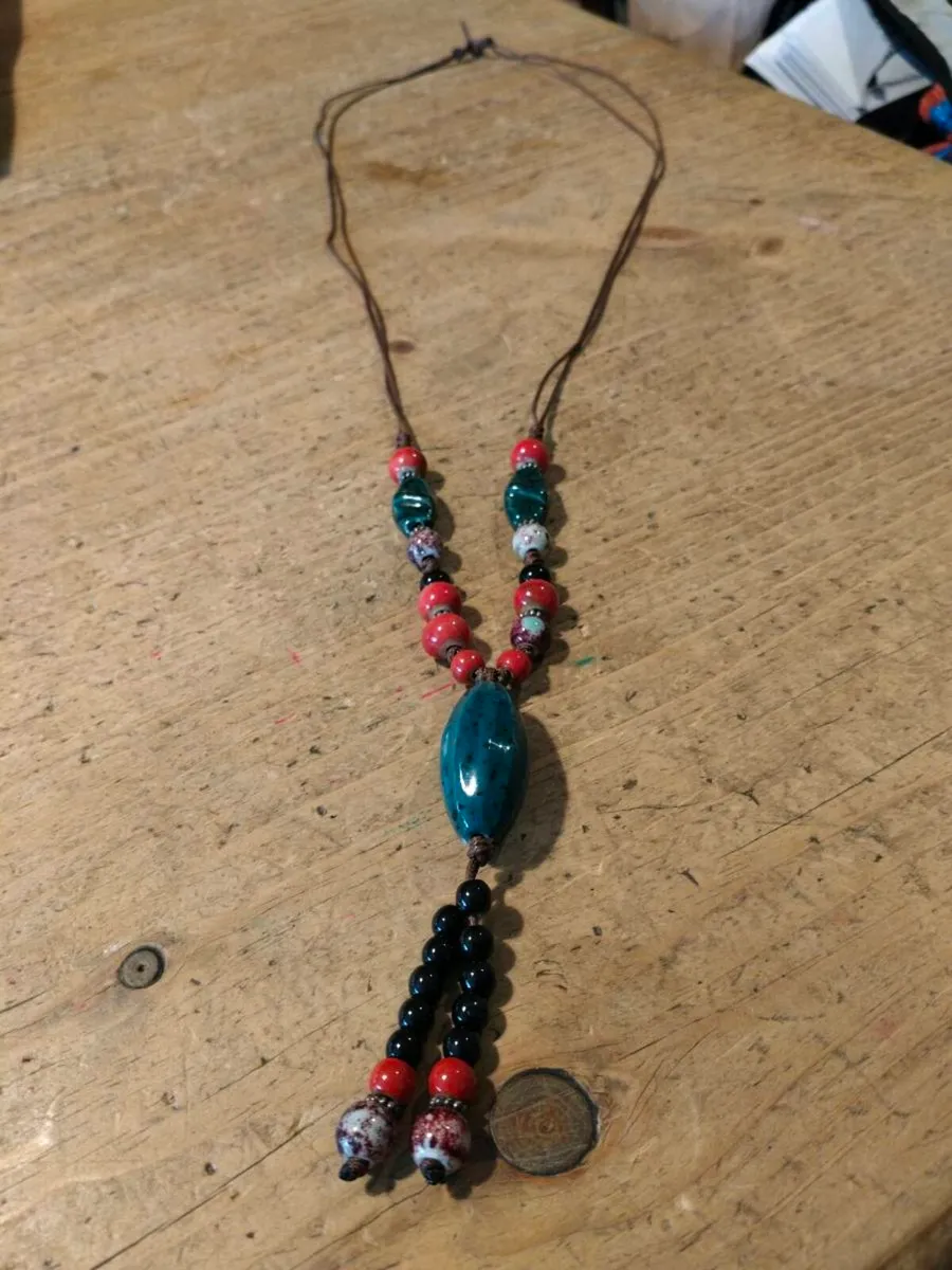 This Bohemian-style necklace features a prominent - Image 2