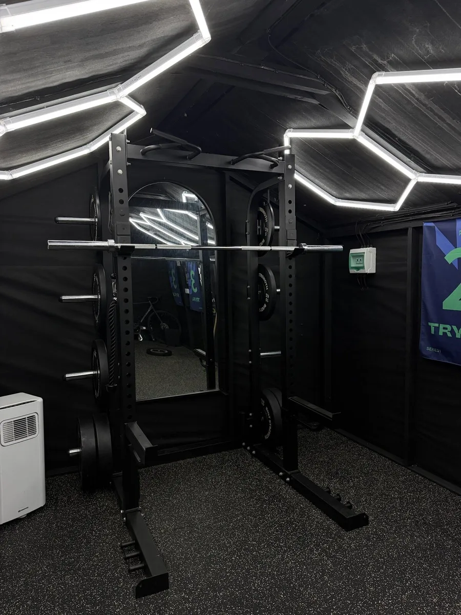 Full commercial Squat rack and 150kg of plates