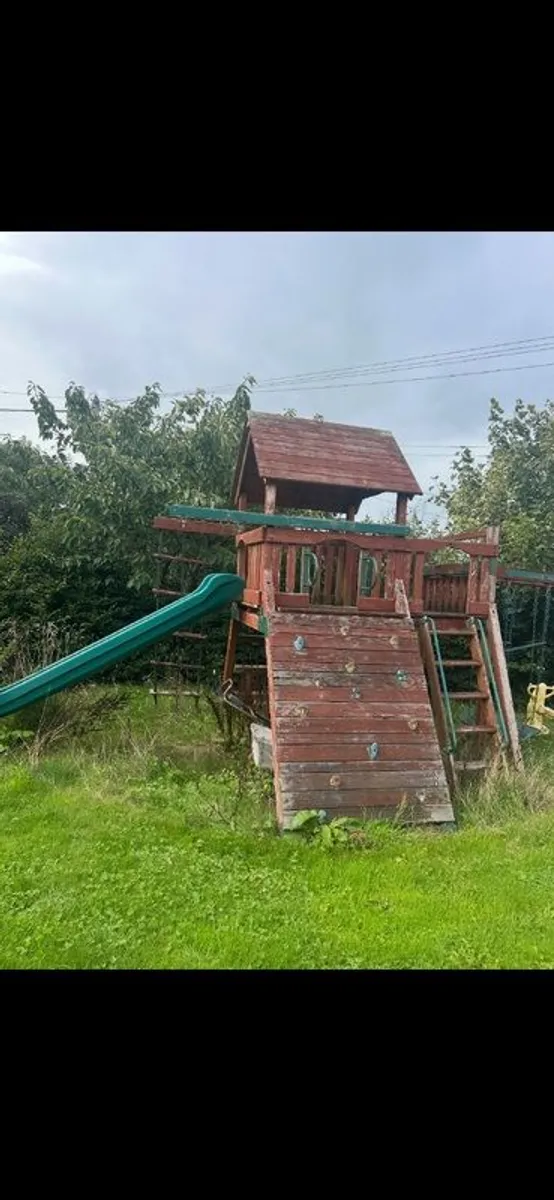 Swing set with slide and tree house - Image 1