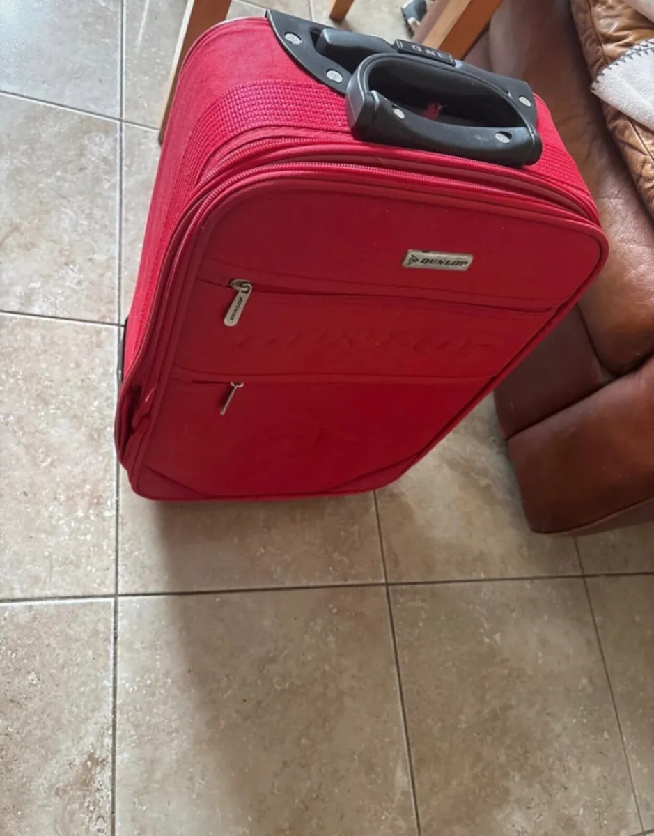 Brand new never used red Dunlop suitcase - Image 1