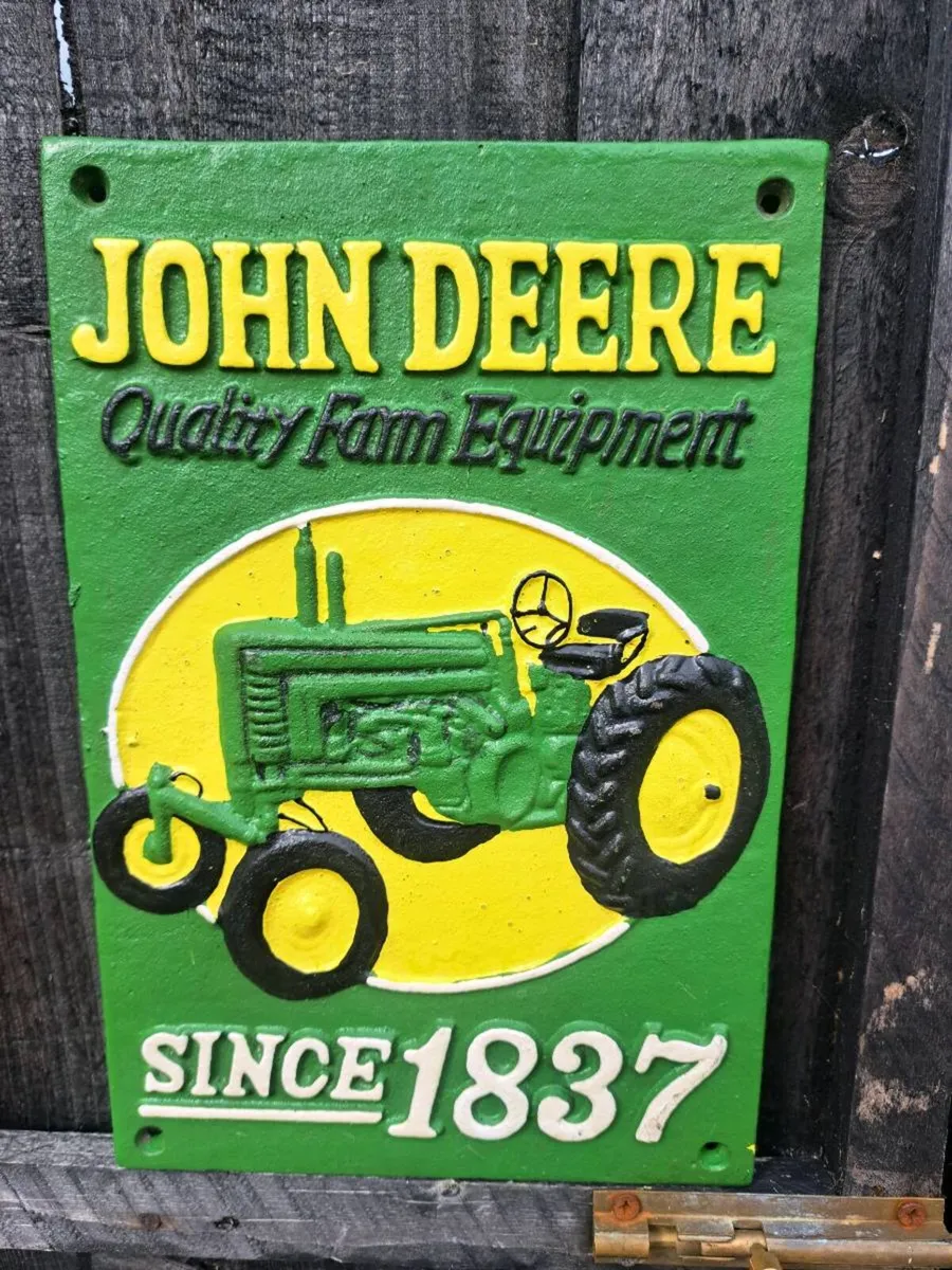 John deer cast iron sign