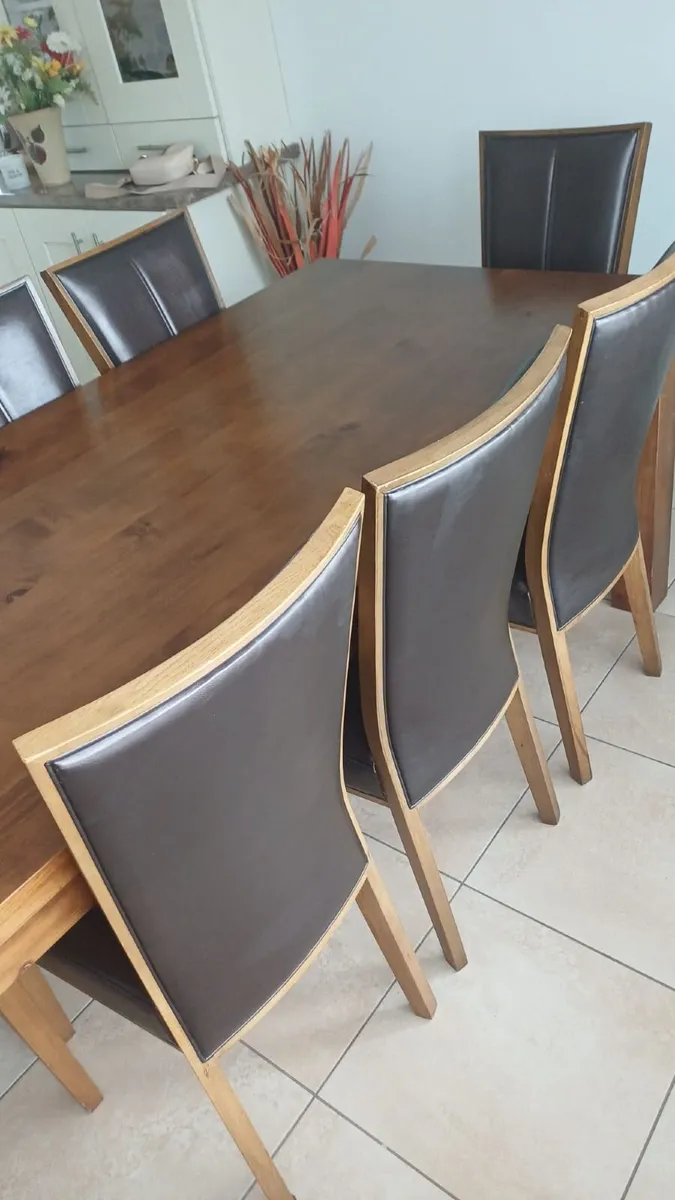 Kitchen table and 8 chairs - Image 1