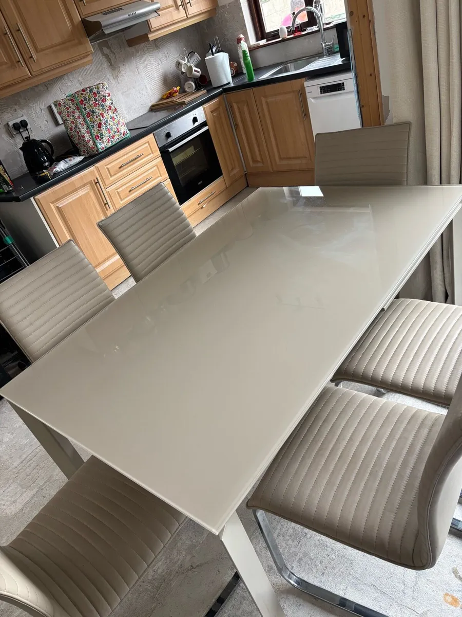 Extending dining table and chairs for sale - Image 1