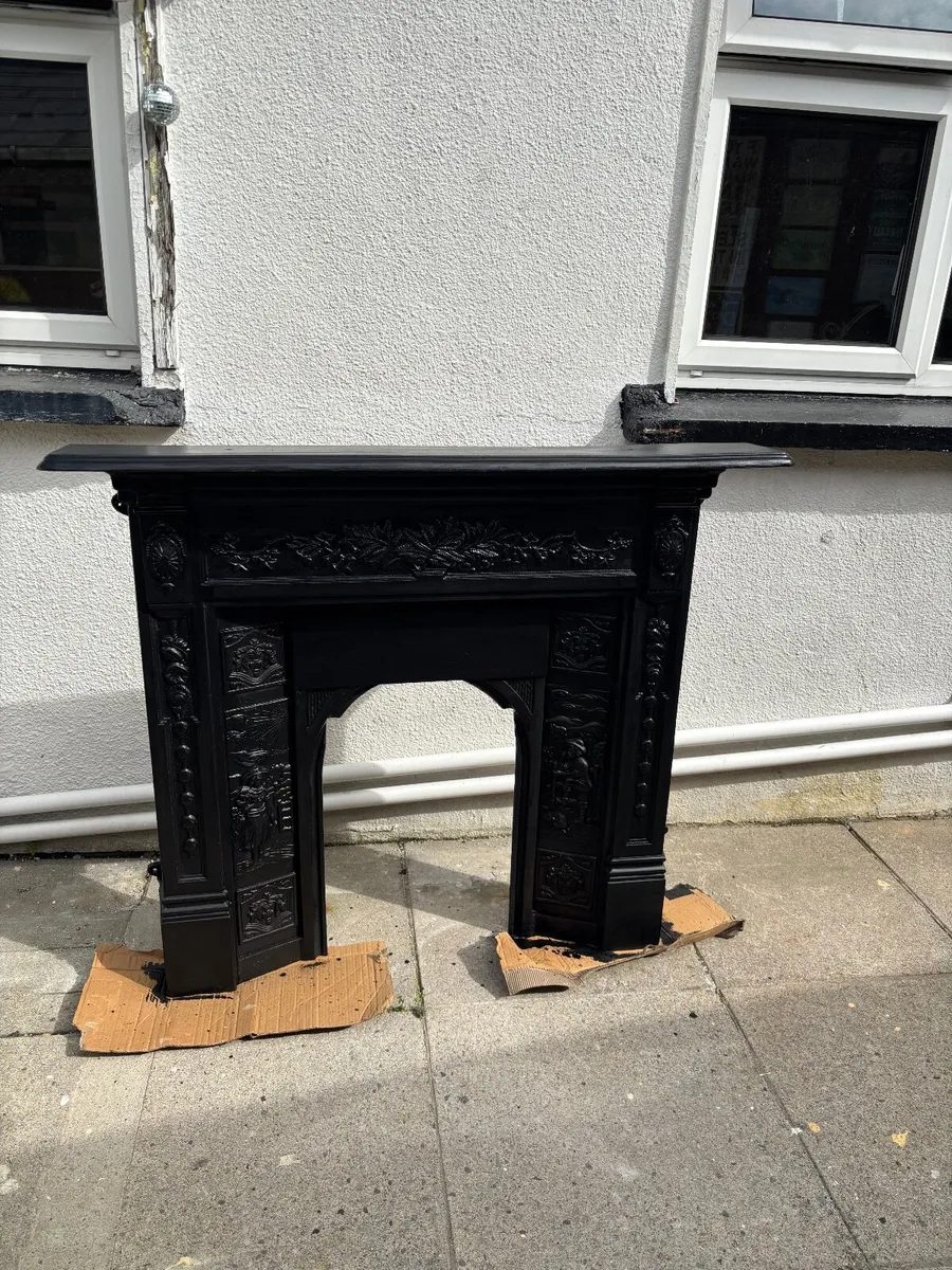 Black cast iron fire surround