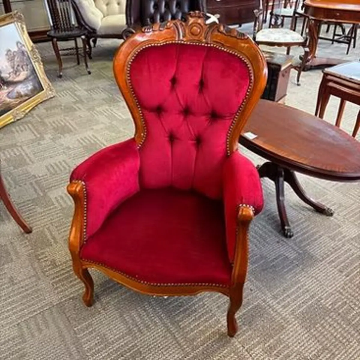 Victorian mahogany armchair with a carved crest