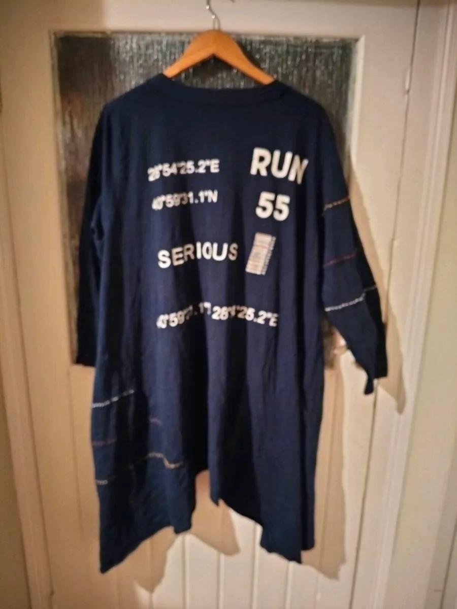 long-sleeved navy garment is an oversized graphic - Image 2