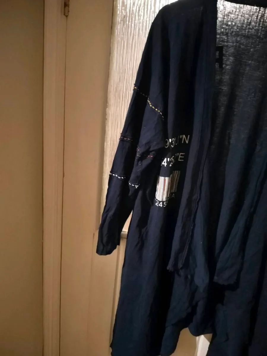 long-sleeved navy garment is an oversized graphic - Image 4