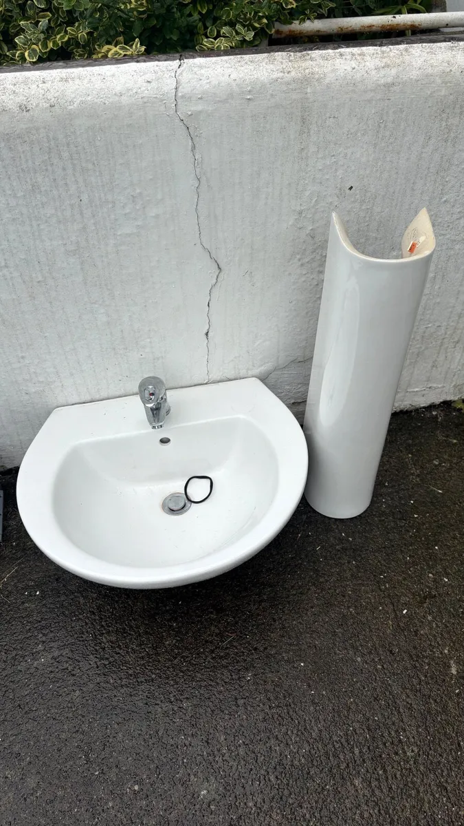 Wash hand basin taps and pedestal
