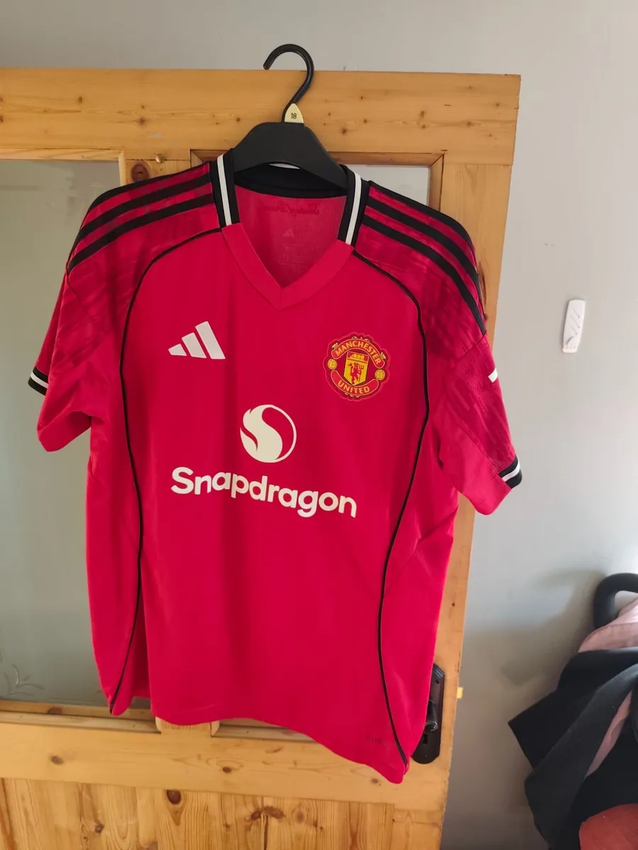 Assortment of Manchester United Jersey's. - Image 1