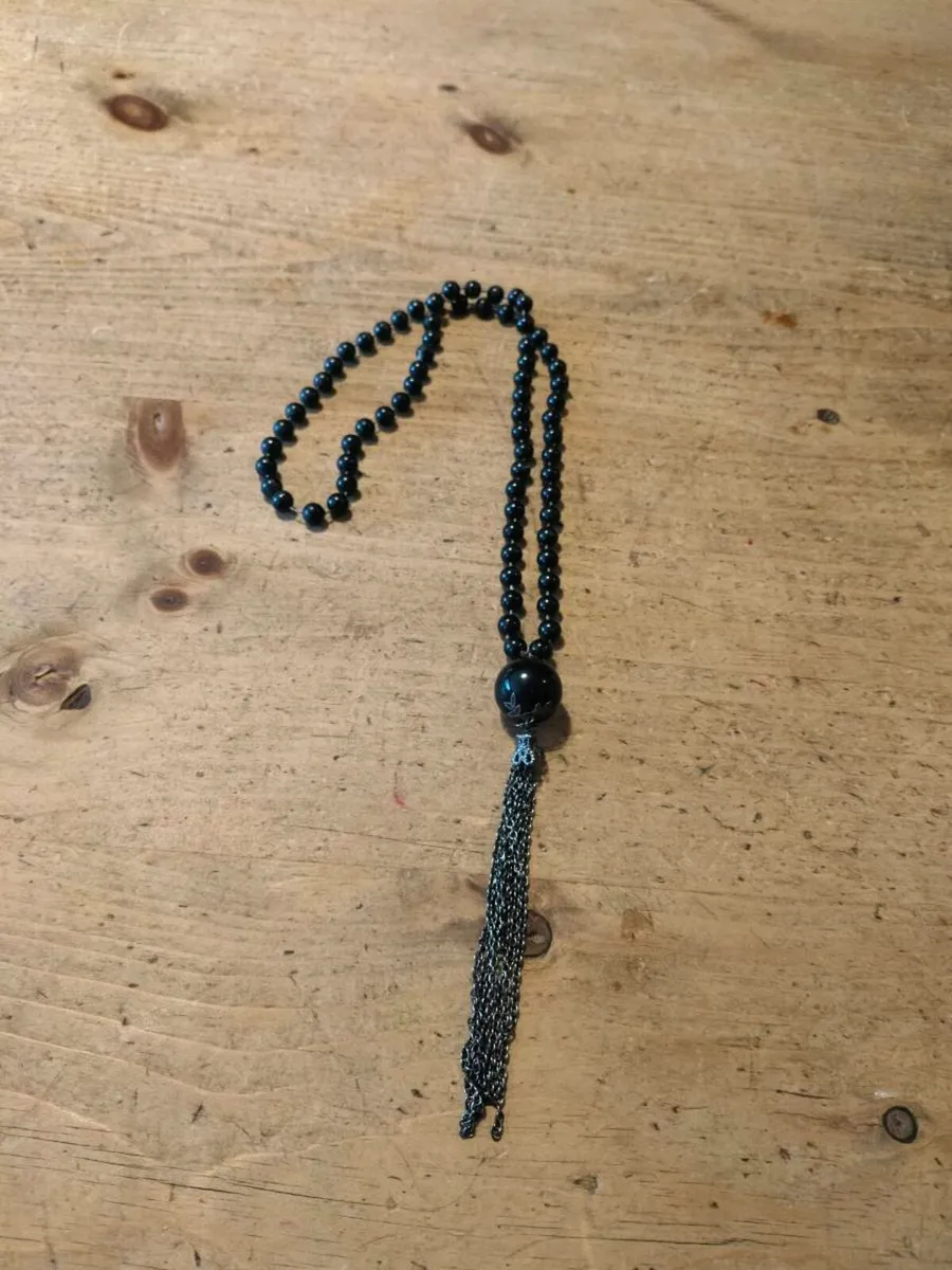 Black necklace features small black beads and a lo - Image 2