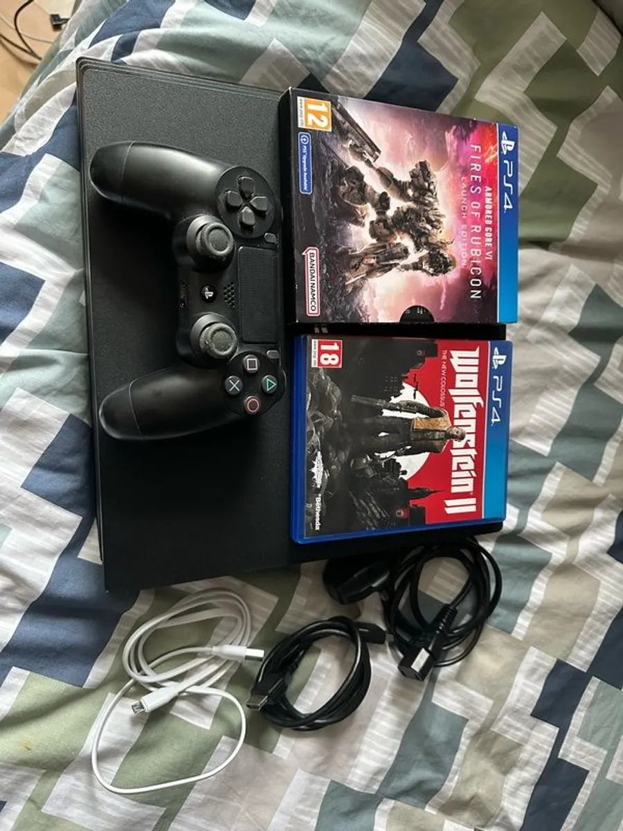 PlayStation 4 Pro 1TB SSD with games, cables and controller - Image 1