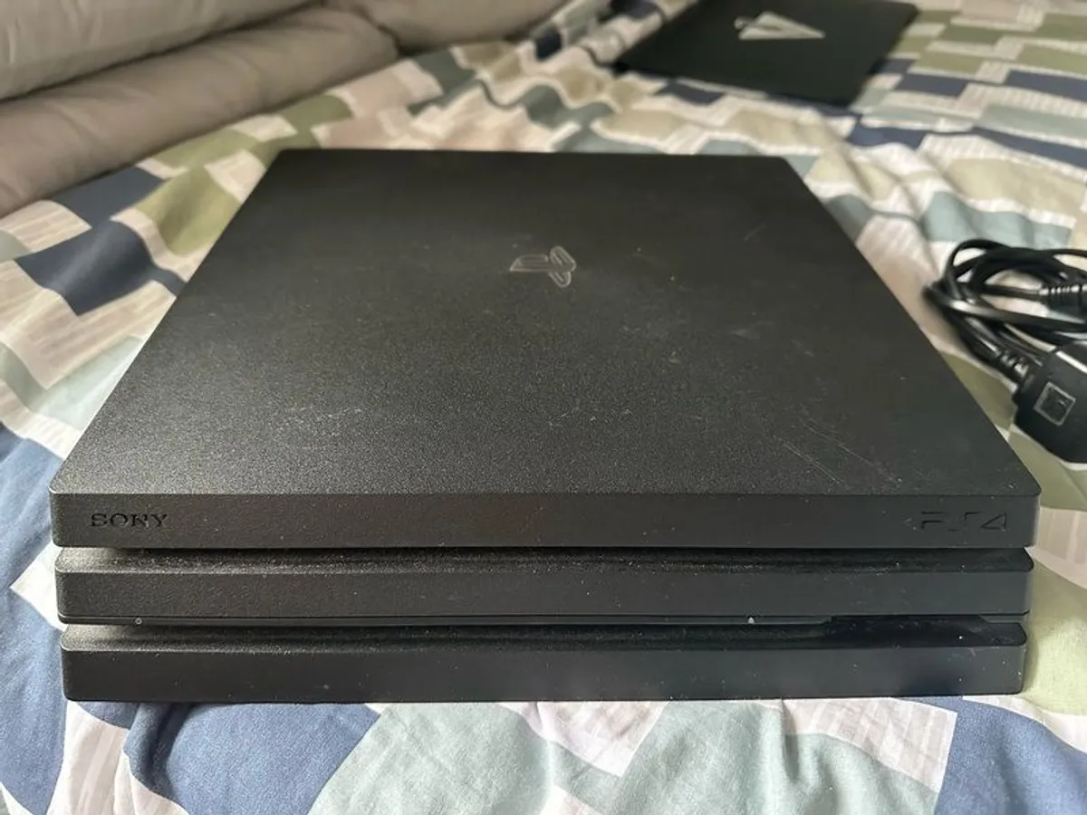 PlayStation 4 Pro 1TB SSD with games, cables and controller - Image 4