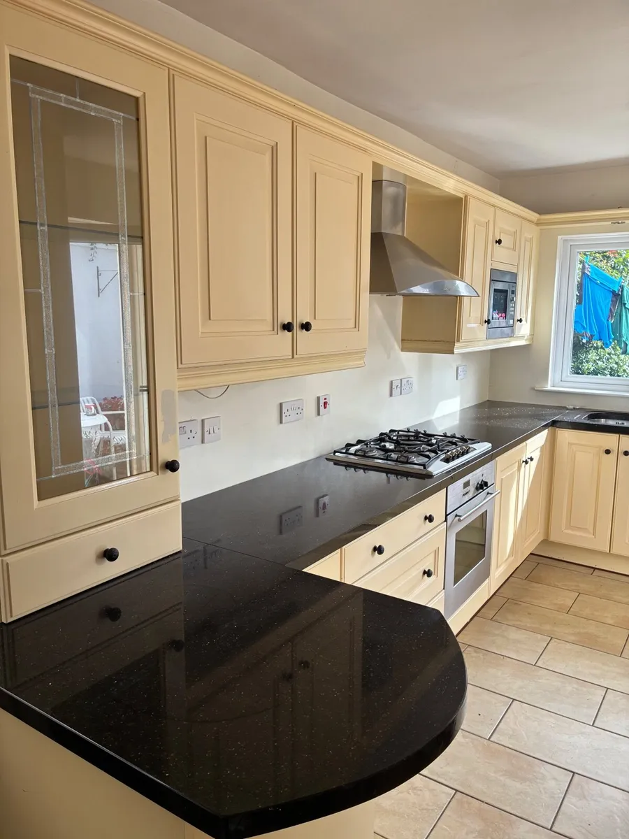 Kitchen including units and granite counter top - Image 1