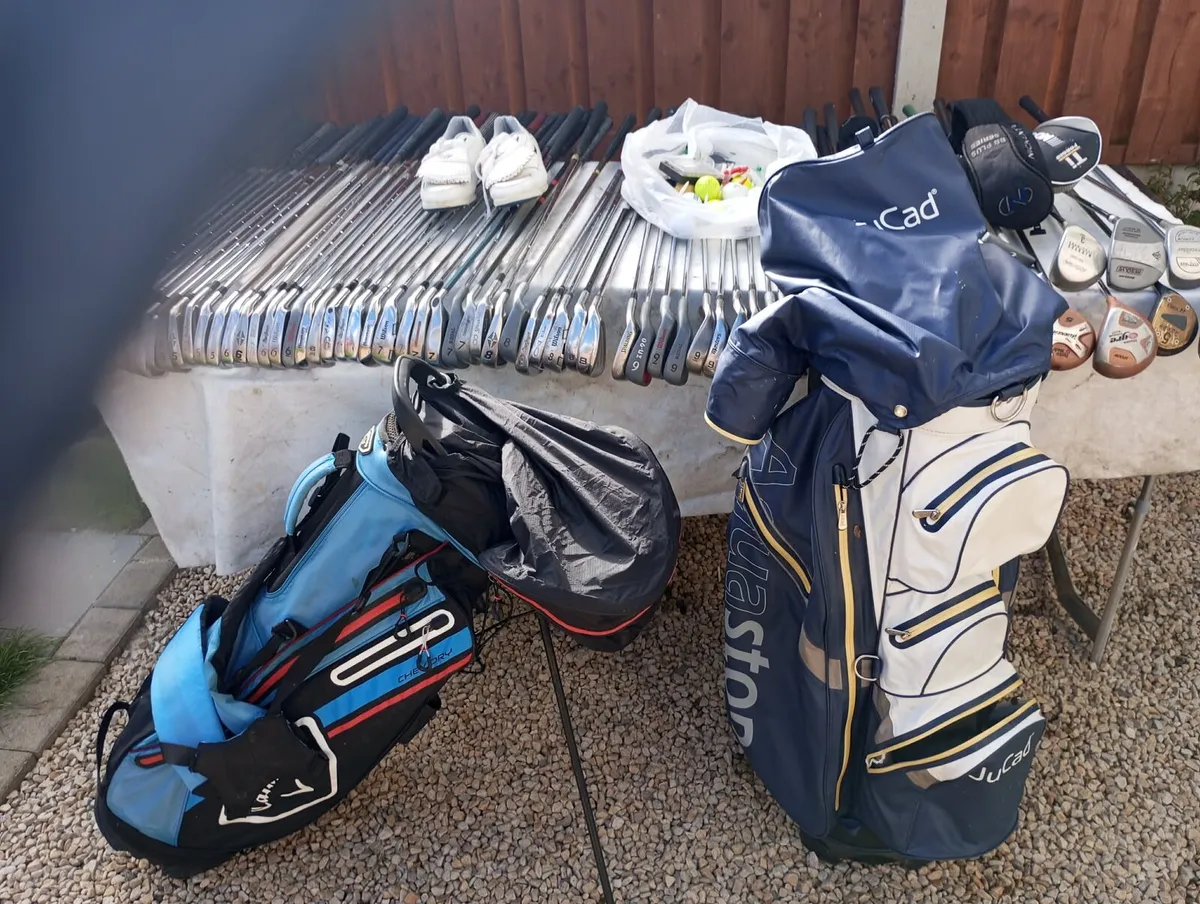 A selection of golf clubs and bags - Image 1